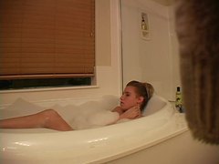 LovelyClips presents: Hidden camera captures girl masturbating in bathtub