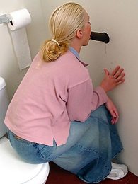 LovelyClips presents: Blonde girl Jamie sits on the toilet and blows a black gloryhole dong